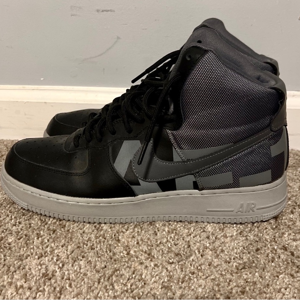 Grey and black mid AF-1s. Size 11.5.